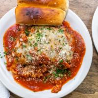 Lasagna · Layers of homemade pasta overlaid with meat sauce and Mozzarella baked to perfection.