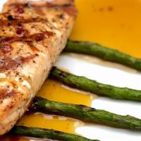 Orange Salmon · Spicy. Grilled Atlantic salmon covered in a spicy orange-honey glaze and laid on asparagus s...