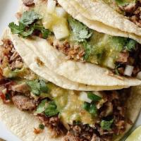 Carnitas Tacos · Recommended. 3 of our signature carnitas tacos served with onion, cilantro, and salsa verde ...