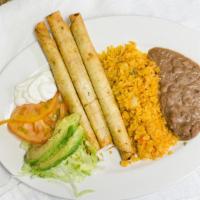 Chicken Flautas · Rolled-up tortilla that contains chicken served with rice and beans.