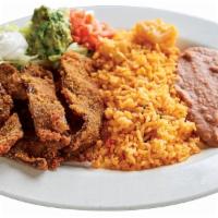 Beef Milaneza · Choice of corn or flour tortilla. A thin cut of meat that is breaded and fried served  with ...