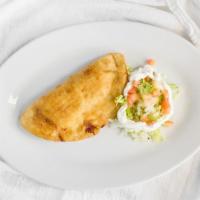 Chicken Empanada (Each) · Baked chicken empanada made of chicken filling enclosed in a buttery and flaky pie crust.