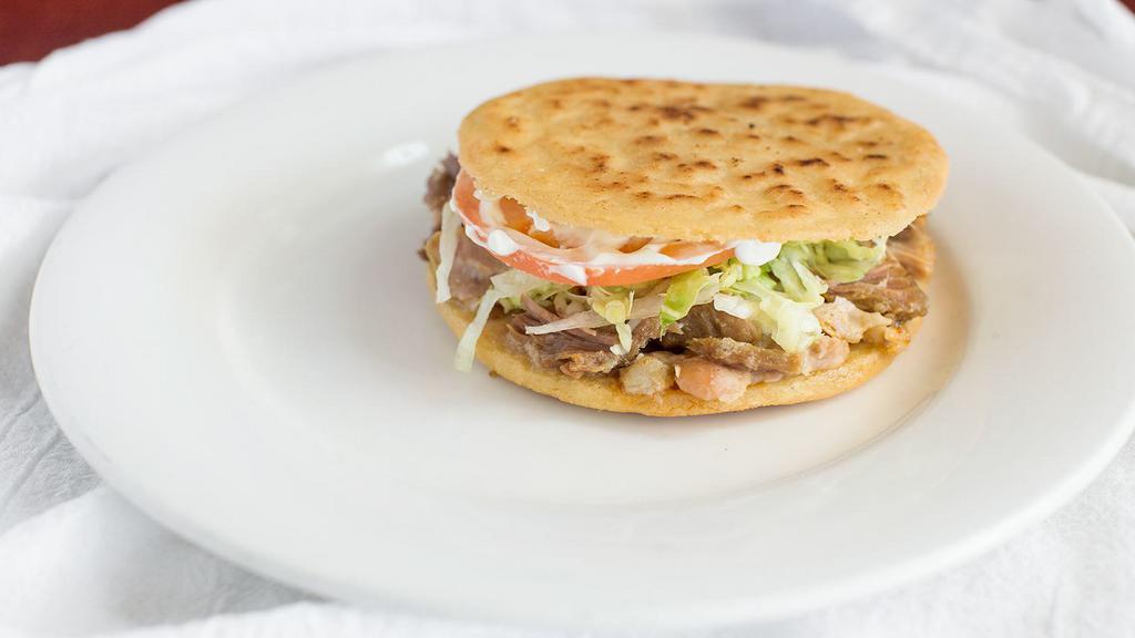 Gordita · Authentic Mexican gordita served with your choice of meat. (Beans, Meat, Lettuce, Sour Cream, Tomatoes, Mozzarella Cheddar Cheese).