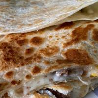 King Quesadilla · Large 10” Flour Quesadilla, Choice of Beef or Chicken Includes sour cream & Hot Sauce on the...