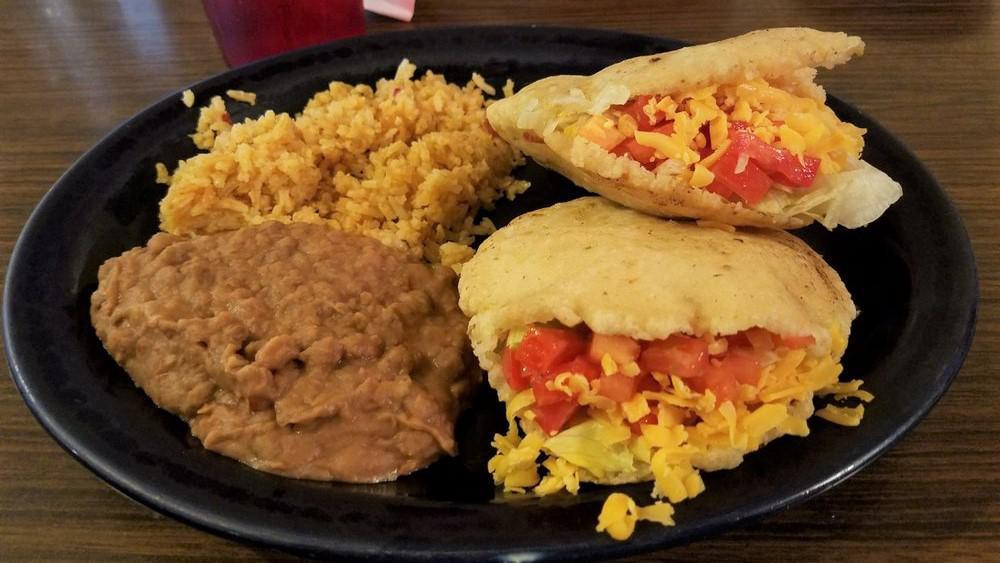 Gorditas Plate · Two Gorditas Filled With Chicken Or Beef, Lettuce, Cheese, And Tomatoes Served With Rice And Beans