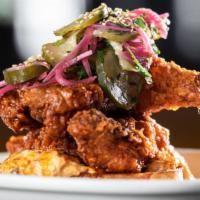 Nashville Hot Tenders · spicy chicken tenders, pimento cheese toast, dilly pickles, pickled red onions
