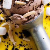 Pint - Rocky Roads · This milk chocolate ice cream is loaded with house-made dark chocolate cookie crumbles, mars...