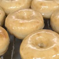 Dozen Glazed Donuts · A dozen (12) of our FAMOUS ORIGINAL yeast-raised donut covered in glaze.