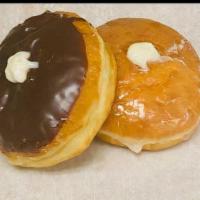 Boston Cream Filled · Our yeast-raised shell donut cover wint chocolate filled with bavarian cream (custard/puddin...
