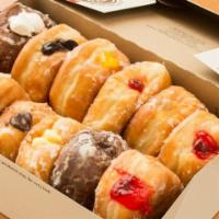 Dozen Filled Do-Nuts · A dozen (12) yeast-raised shell donut filled with a variety of cream or jelly fillings.