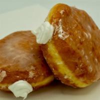 Cream Filled · Our yeast-raised shell donut filled with white whipped cream filling.