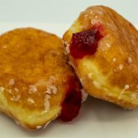 Raspberry Filling · Yeast raised shell donut filled with raspberry jelly.