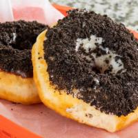 Vanilla (White) Iced Oreo · Our yeast-raised donut dipped in vanilla white icing covered in crushed oreos.