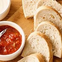 Bread And Dipping Sauce Trio · Enjoy our warm bread with a trio of made-from-scratch sauces including Alfredo, Marinara and...