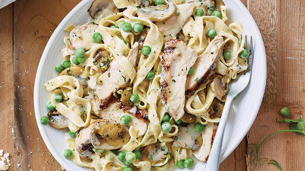 Fettuccine Carrabba · Fettuccine Alfredo with wood-grilled chicken, sautéed mushrooms and peas