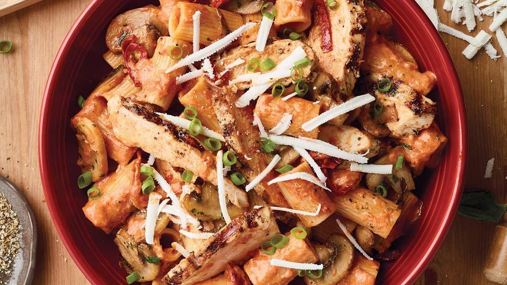 Rigatoni Martino · Sauteed mushrooms, sun-dried tomatoes, parmesan and romano cheese tossed with rigatoni pasta in our tomato cream sauce topped with scallions and ricotta salata