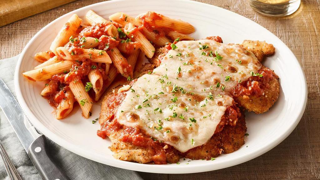 Chicken Parmesan · Coated with Mama Mandola's breadcrumbs, sautéed and topped with our pomodoro sauce, parmesan, romano and mozzarella. Served with your choice of side.