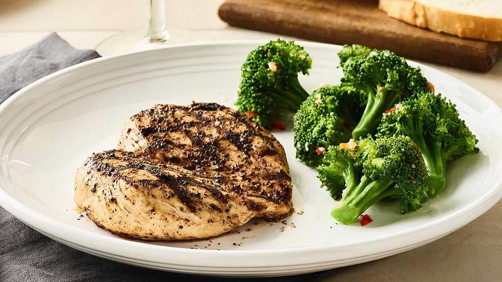 Tuscan-Grilled Chicken · Wood-grilled and seasoned with Mr. C's Grill Baste, olive oil and herbs