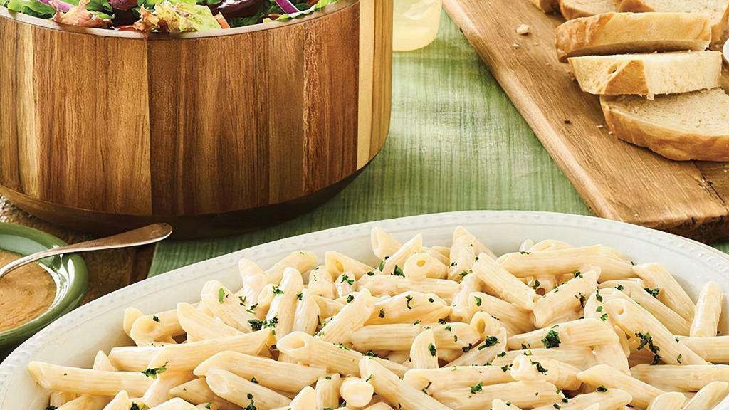 Family Bundle Penne Alfredo · Our made-from-scratch Alfredo tossed with Penne pasta. Includes your choice of side salad and bread. Feeds 4-5 people.