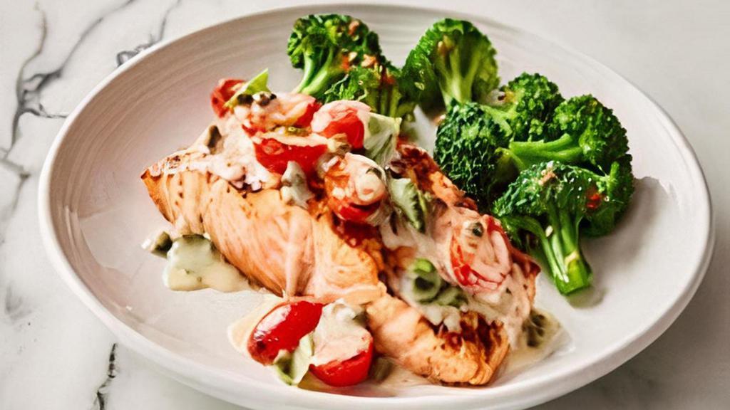 Salmon Capperi Family Bundle · Wood-grilled Salmon topped with
oven-roasted grape tomatoes, fresh basil, capers and our lemon butter sauce. Served with a choice of Garlic Mashed Potatoes, Penne Pomodoro or Sautéed Broccoli. Includes your choice of salad and bread. Feeds 4-5.