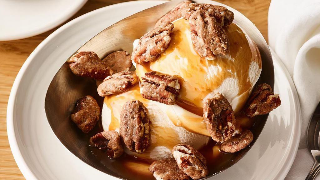 John Cole** · Vanilla ice cream with caramel sauce and roasted cinnamon rum pecans **Item contains or may contain nuts