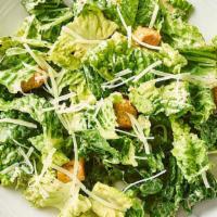 Side Caesar Salad · Fresh Romaine, croutons and parmesan cheese served with a side of our Caesar dressing.
