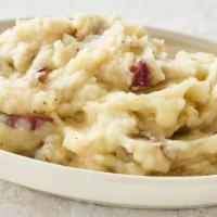 Garlic Mashed Potatoes · Mashed potatoes whipped with roasted garlic butter and cream