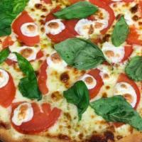 Classic Margarita Pizza · Red sauce, fresh basil, tomatoes and fresh Mozzarella cheese.