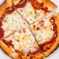 Saganaki Pizza · Cheese lovers. Mozzarella cheese, Romano cheese, feta cheese, Parmesan cheese, oregano.
