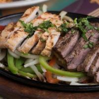 Berryhill Fajitas · Served sizzling! Marinated fajita beef or grilled chicken breast with grilled peppers and on...