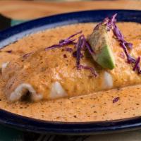 Supremo Burrito · Chicken or beef fajita meat, guacamole and red cabbage topped with a chipotle vinaigrette cr...