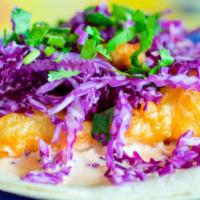 Original Fish Taco · Award Winning. Tempura-fried fish with red cabbage, special sauce and cilantro double-wrappe...