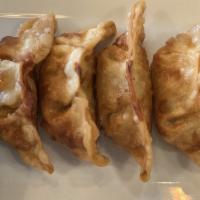 Veggie Dumpling · Deep-fried chive dumplings served with tasty vinaigrette soy sauce.