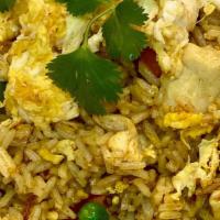 Yellow Curry Fried Rice · Yellow curry seasoning, green peas, egg, carrots, onions and bell peppers served with little...