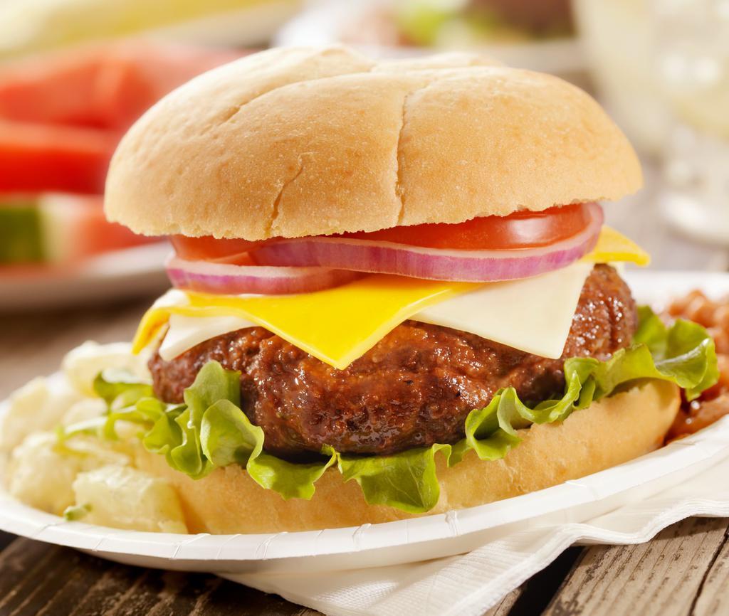 White Cheddar Burger · (960cal). Grilled steakhouse style burger, aged white cheddar, plum tomatoes, leaf lettuce, red onions on a gourmet hamburger bun, choice of bread.