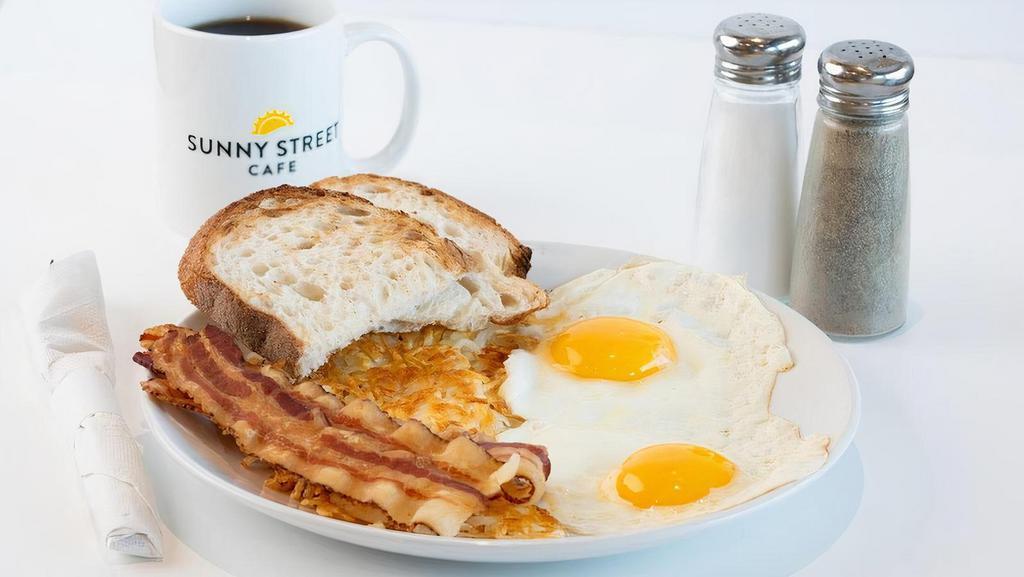 Big Bite Breakfast · Two eggs, choice of bacon, sausage, or ham, choice of side & toast