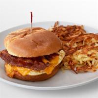 Big Breakfast Sandwich · Two over-hard eggs, bacon, cheddar, and chipotle mayo on a toasted brioche roll with choice ...
