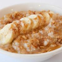 Banana Bread Oatmeal · A bowl of gluten free oats from Bob's Red Mill, sliced banana, brown sugar, chopped walnuts,...