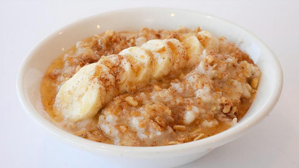 Banana Bread Oatmeal · A bowl of gluten free oats from Bob's Red Mill, sliced banana, brown sugar, chopped walnuts, cinnamon & a drizzle of honey