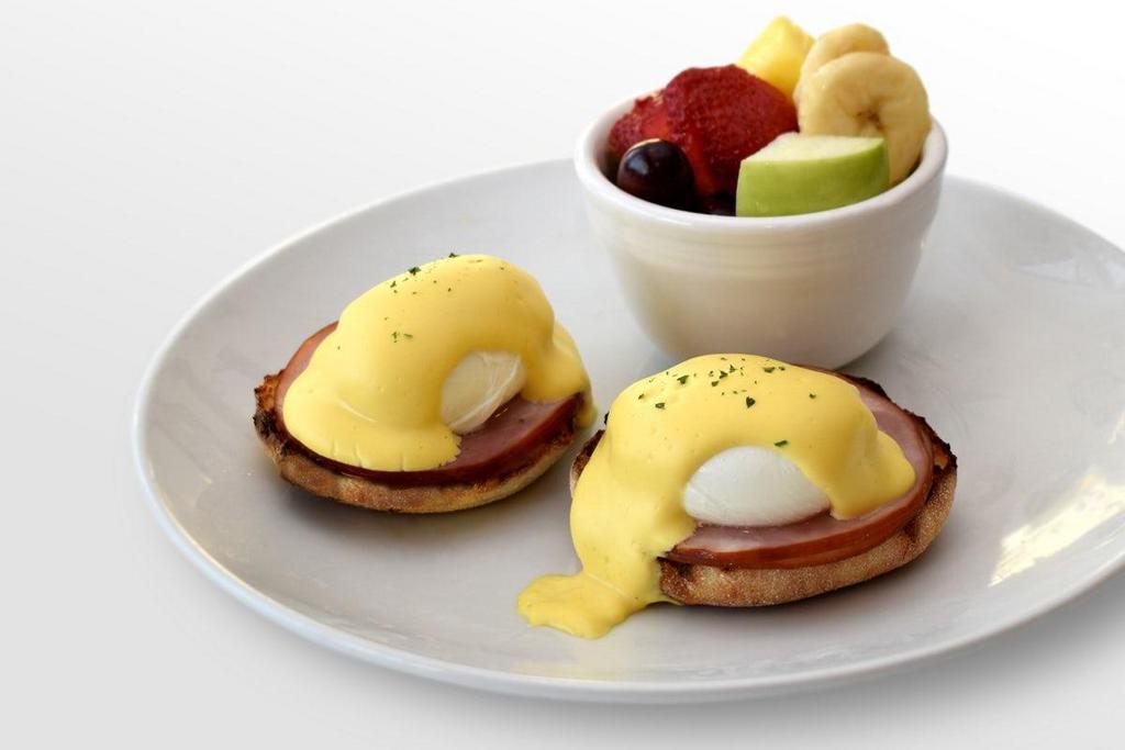 Eggs Benedict · Poached eggs, Canadian bacon, toasted English muffin, creamy hollandaise, choice of side