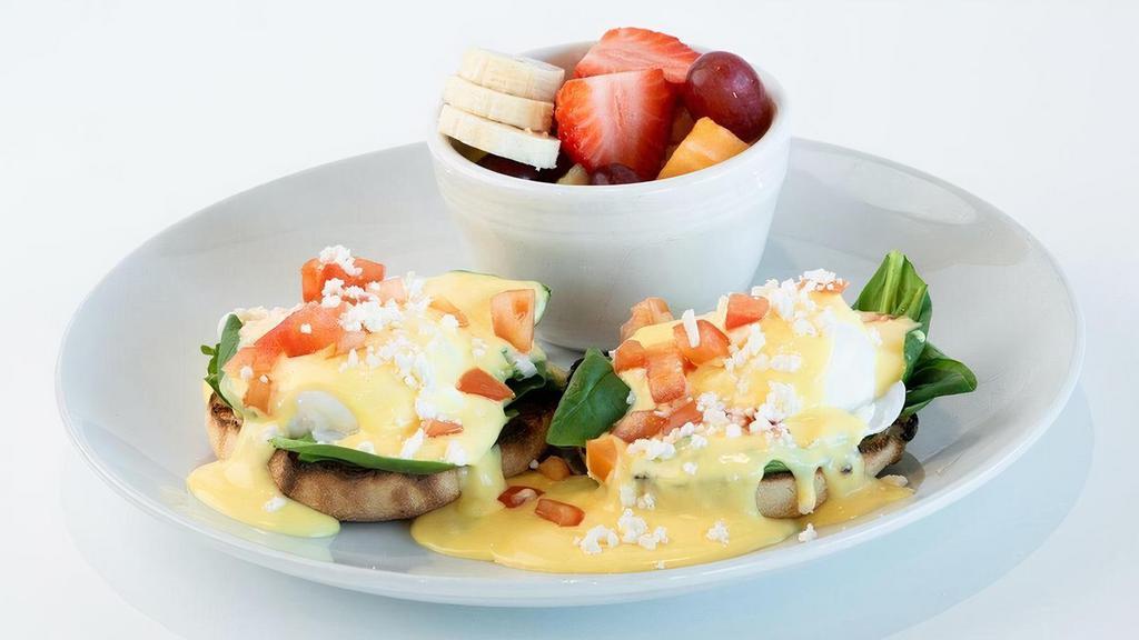 Sunny Street Benedict · Poached eggs, fresh spinach, toasted English muffin, creamy hollandaise, diced tomato & feta, choice of side