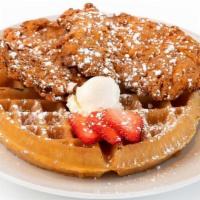 Chicken & Waffles · Hand-breaded fried chicken on a golden waffle, with honey butter and house hot sauce on the ...