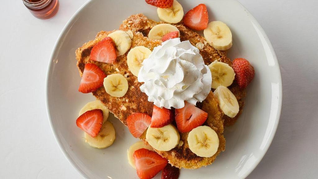 French Toast Crunch · Sweet granola-crunch coating, strawberries, bananas & whip