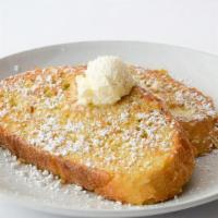 Thick Griddled French Toast · Thick-sliced sourdough dipped in cinnamon cream batter