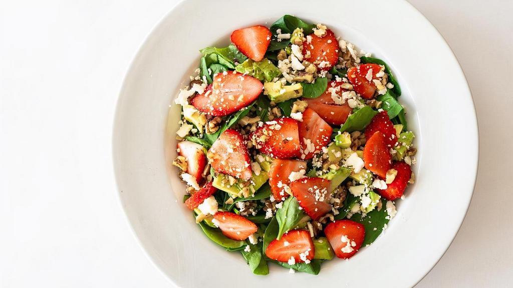 Berry Avocado Salad · Fresh greens with extra spinach, strawberries, avocado, feta & candied walnuts served with red wine vinaigrette