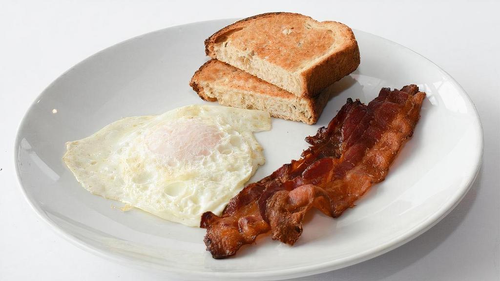 Kids Eggs · One egg cooked to order with your choice of meat and toast.