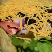 Taco Salad · Tortilla shell, ground beef, rice and 5 toppings