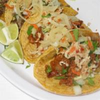 Street Tacos · Served with onions and cilantro, Mexican coleslaw, and lime.