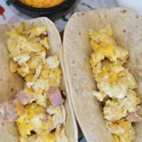 Breakfast Tacos · Egg, cheese and one meat.