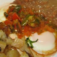 Huevos Rancheros · Served with beans and potatoes, tortillas.